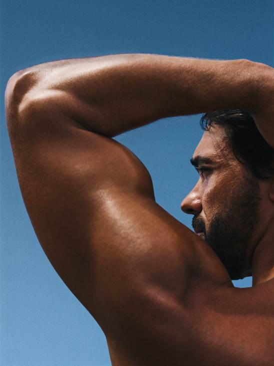 Man with his arm raised behind his head