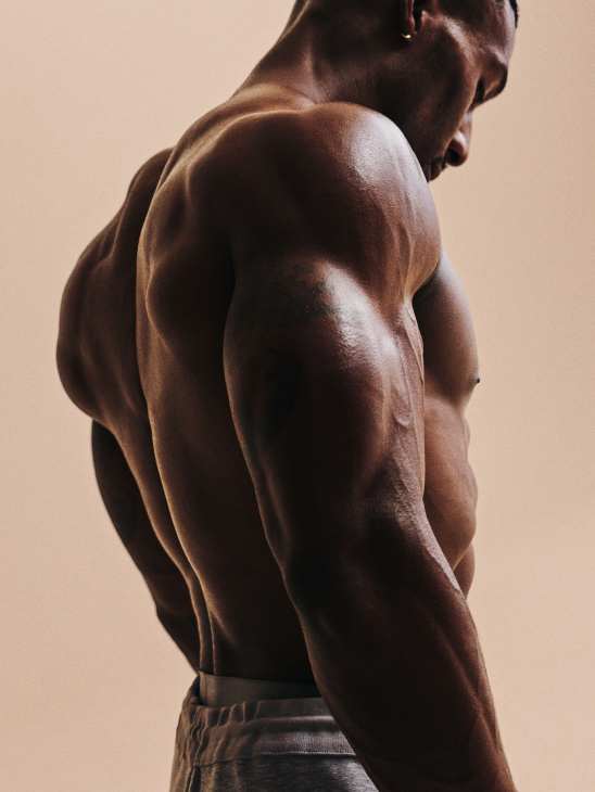 Shirtless man seen from behind