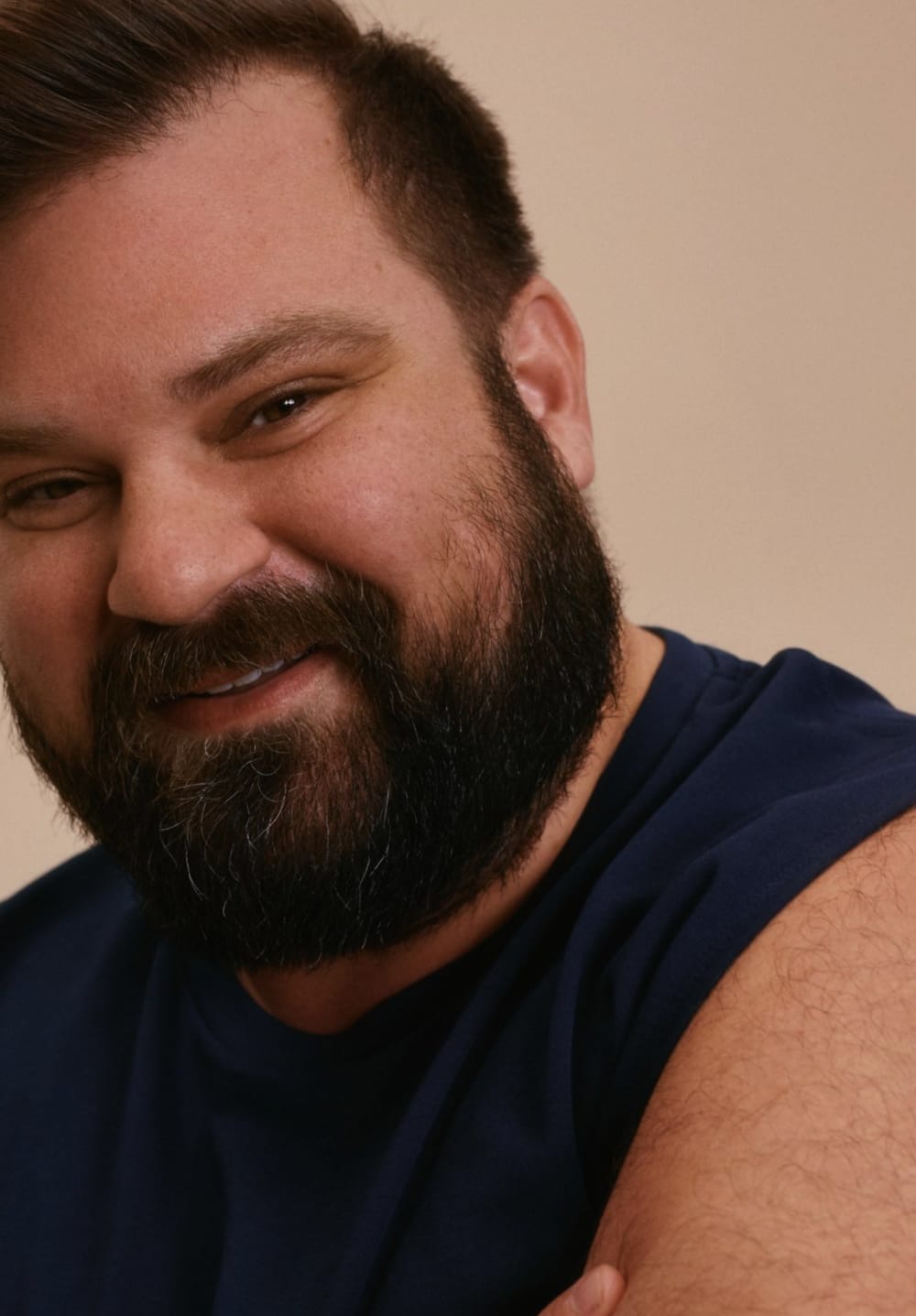Close-up of a man in a baseball cap smiling
