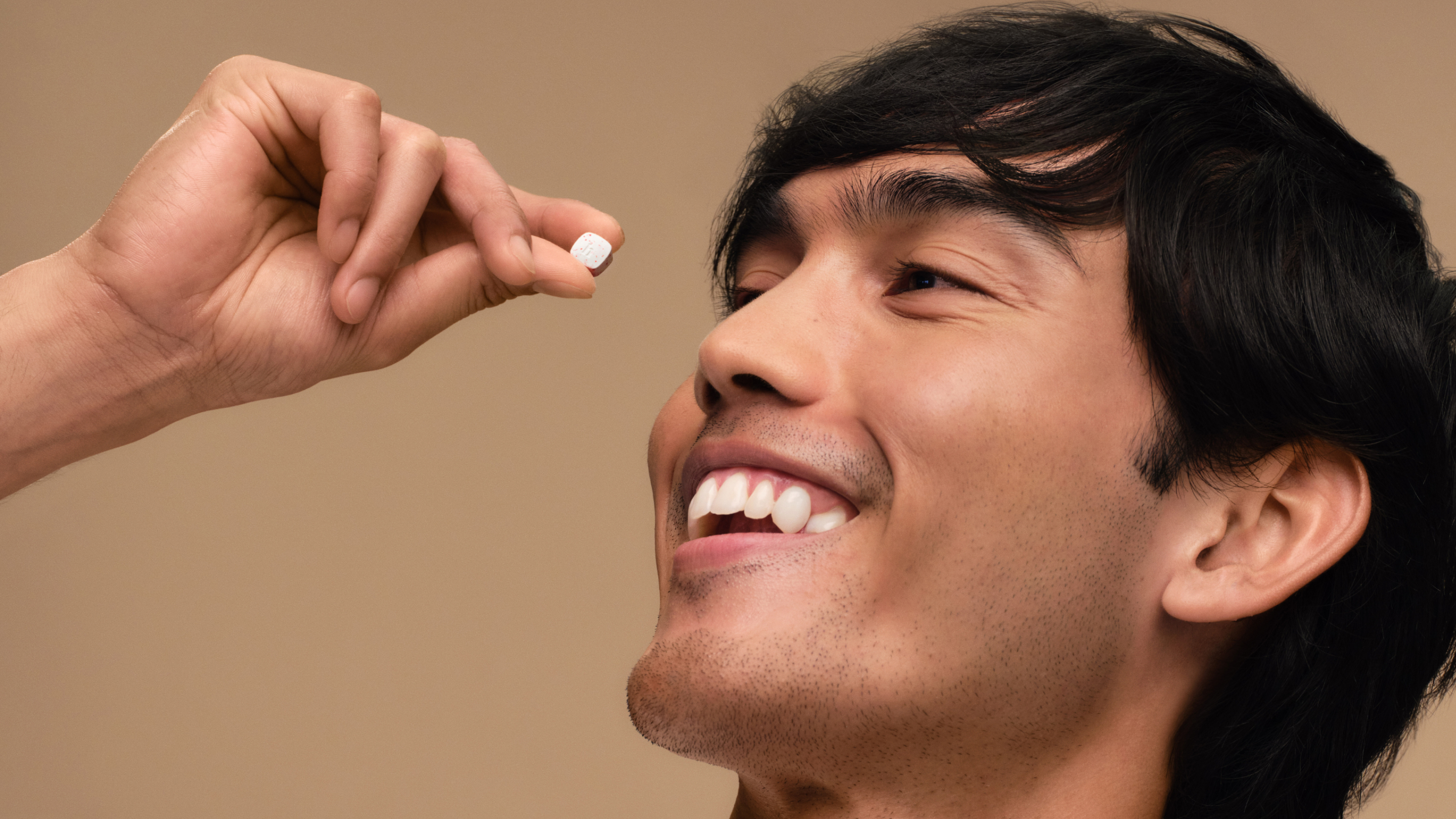 man with hair chew smiling